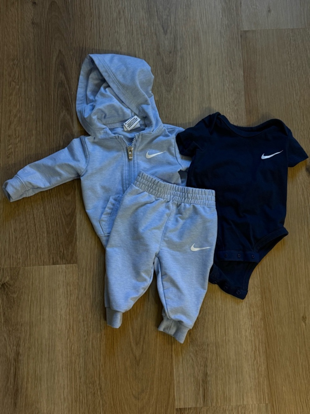 Nike Baby Blue Zip Hoodie, Joggers, and Navy Blue Short Sleeved Onesie